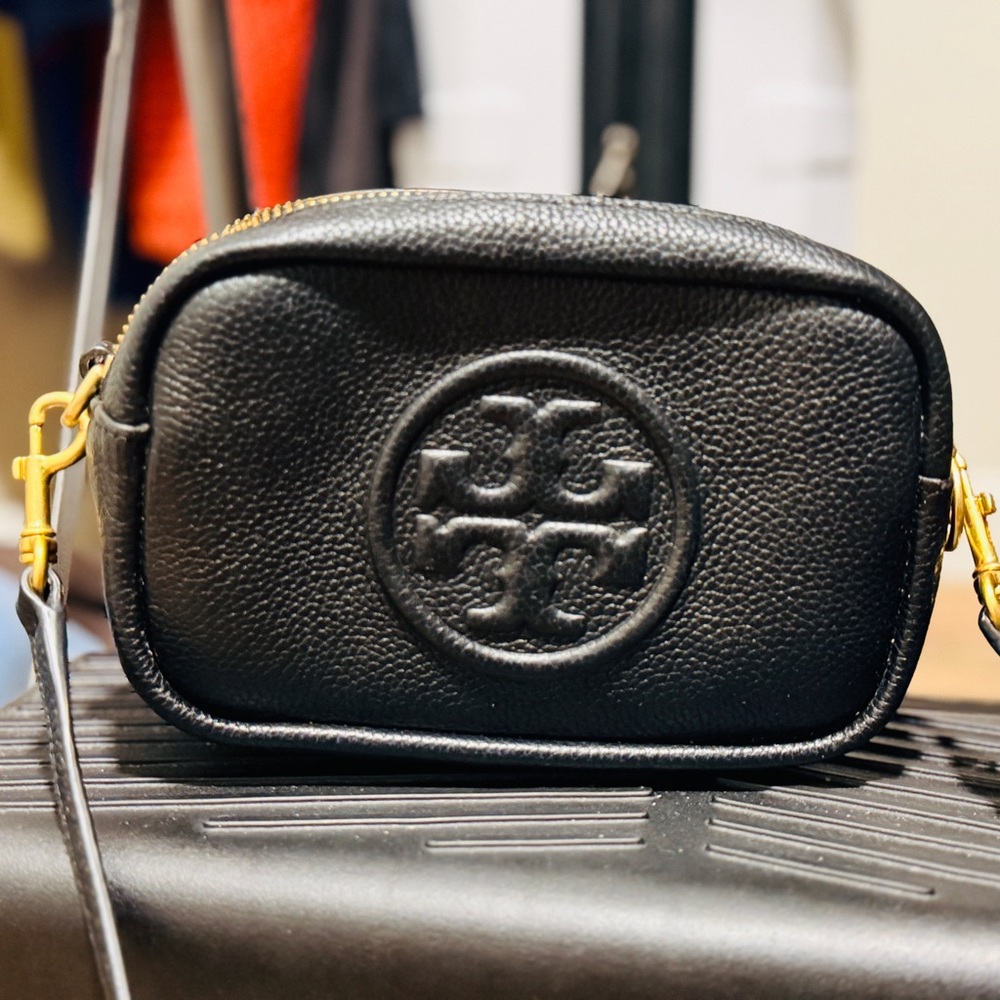 Tory Burch Perry Bombe Mini Crossbody in black leather.